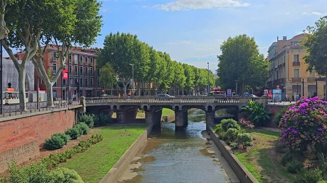 PERPIGNAN, FRANCE - SEPTEMBER 21, 2023: A view of the Magenta bridge above the Basse River in Perpignan
