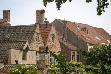 Historic brown grey brick house rooftops in Bruges, Belgium