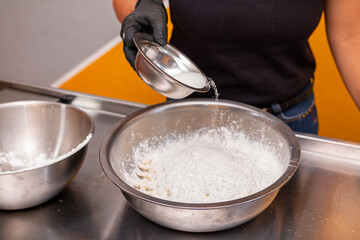 Pastry chef adds sugar to bakery recipe