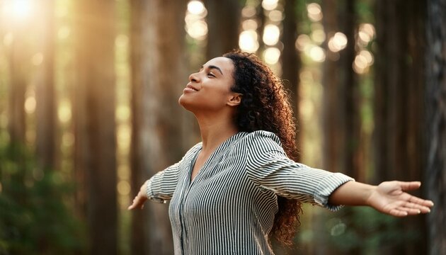 woman breathing clean air in the forest, girl, open arms, concept free