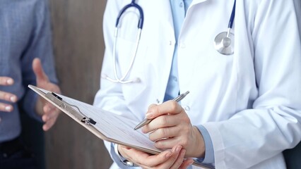 Doctor reviewing patient's medical records