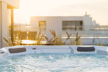 Luxurious hot tub on top of residential building with open space terrace