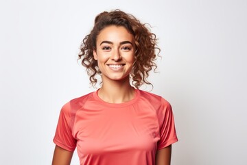 Fototapeta premium Portrait of a content woman in her 20s wearing a moisture-wicking running shirt isolated on white background
