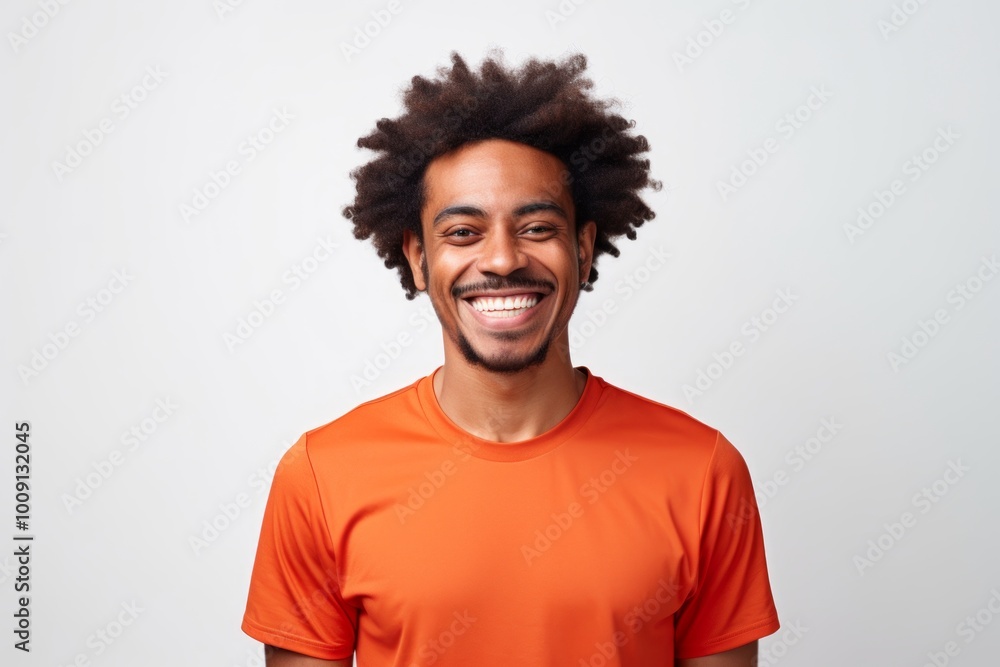 Poster Portrait of a grinning afro-american man in his 20s sporting a breathable mesh jersey isolated on white background