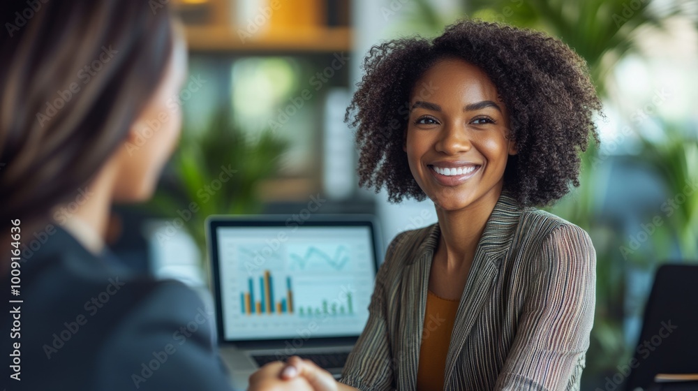 Poster a woman is smiling at a laptop screen with a graph on it