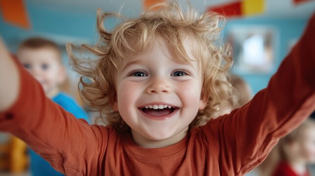 Blonde child with curly hair joyfully reaching towards the camera with outstretched arms, capturing a moment of innocence, happiness, and youthful exuberance.