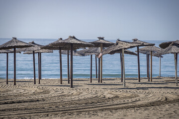 Parasols on a deserted beach