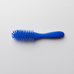 A blue plastic hairbrush designed for detangling and styling hair.