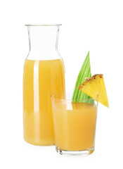 Glass with tasty pineapple juice, jug and piece of fresh fruit isolated on white