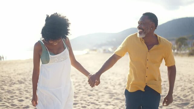 Cinematic video of an happy latin senior couple spending time at the beach. Concept  about seniority and lifestyle