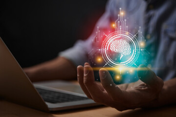 Red Turquoise Ai Technology or Artificial Intelligence Brain Concept. Brain and Circuit Line and HUD Ai Artificial Intelligence Icon on Businessman's Hand With Laptop Computer