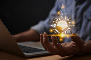 Yellow Ai Technology or Artificial Intelligence Brain Concept. Brain and Circuit Line and HUD Ai Artificial Intelligence Icon on Businessman's Hand With Laptop Computer