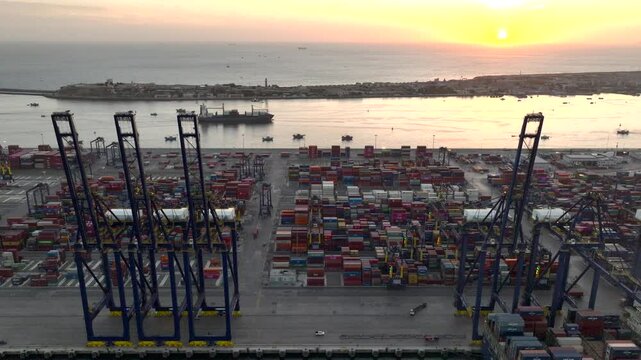 Huge Port of Karachi at sunset time. Cargo Ship Docked at KPT Karachi, Aerial Drone Shot