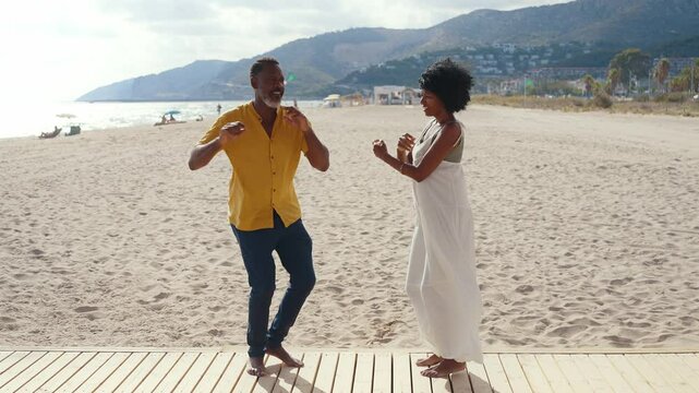Cinematic video of an happy latin senior couple spending time at the beach. Concept  about seniority and lifestyle