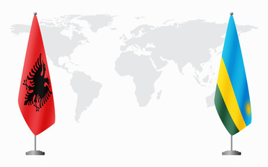 Albania and Rwanda flags for official meeting against background of world map.