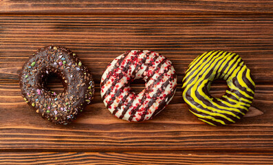 Sweet glazed colorful donuts . Top view