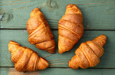 Group of sweet croissant . French morning breakfast . Top view