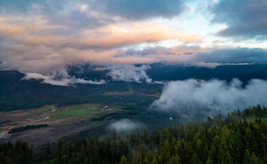 Stunning Aerial View of Stave Lake Surrounded by Misty Clouds in Mission, BC, Canada During Sunrise