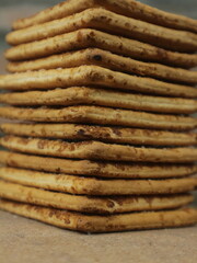 close up pile of dry biscuits cookies