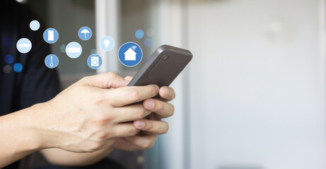 close up man hand holdings smartphone and open application technology for using home automation function with wifi 7  to looking inside or outside home and property for  ai innovation future concept