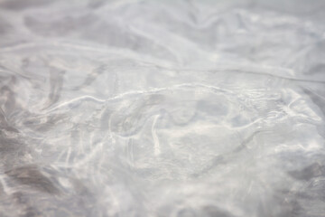 Extreme macro of plastic bubble wrap texture. Selective soft focus, shallow depth of field. Abstract dreamy background