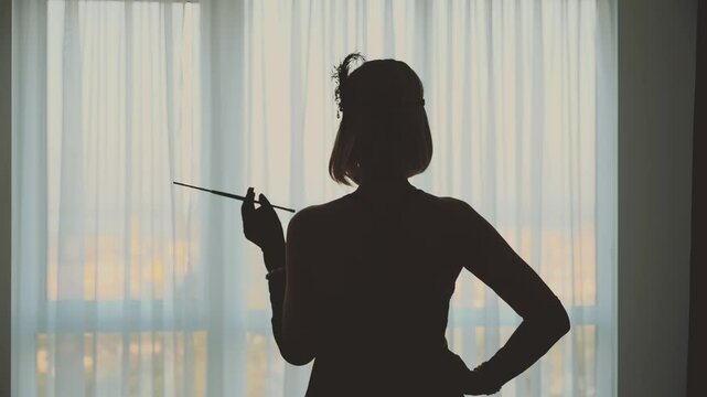 shadow dark silhouette Retro lady smoker hand holding cigarette holder, Beauty Luxury woman old style 20s feather black dress back rear view. Happy sexy mystery gorgeous Girl looking at window art 4k