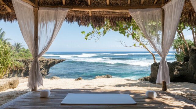 A beach with a white canopy and a view of the ocean