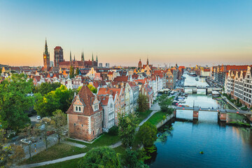 Fototapeta premium View of the Main Town in Gdańsk. Beautiful tenement houses, Motława at sunset.