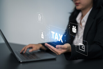 Close up of a mid adult woman checking her energy bills at home,  Busines using a computer to complete Individual income tax return form online for tax payment.