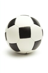 A close-up of a black and white soccer ball on a white surface