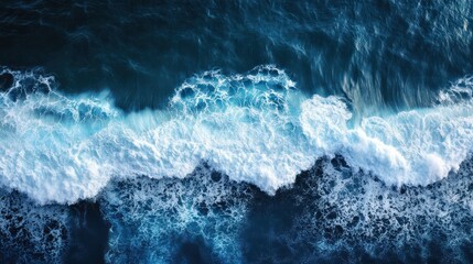 Obraz premium An impressive aerial photo showing ocean waves crashing in deep waters ideal for backgrounds A drone s bird s eye perspective captures the dynamic seascape in this captivating copy space image