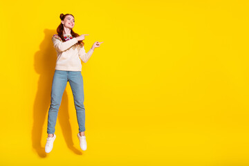 Photo portrait of attractive woman jump point look empty space dressed stylish knitted warm outfit...