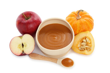 Delicious baby food in bowl with spoon and fresh ingredients isolated on white