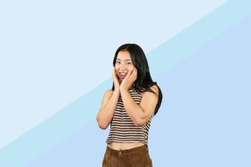 Excited Asian Student Girl gives expression hand fa gesture of sad, wow, happy, laughing in blue...