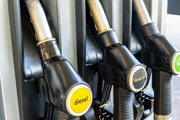 refuel station close up with three refueling dispensers of petrol and diesel on gas station. modern...