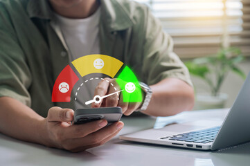 Customer Satisfaction, Digital rating concept. person interacting with a satisfaction meter on a smartphone, indicating feedback with happy, neutral, and sad emoticons.