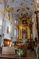 Ornate Baroque Church Interior with Golden Altar and Vaulted Ceiling