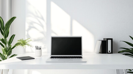 Fototapeta premium Minimalist home office setup with laptop and plants in clean bright workspace