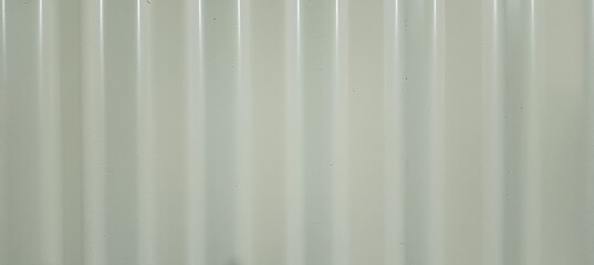 Obraz premium Fresh corrugated tin texture in a warm cream color, highlighting soft metallic ridges for a rustic yet modern look