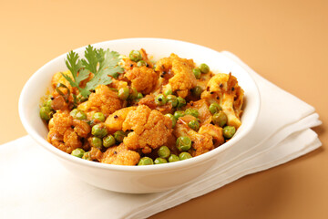 Aloo gobi is a simple vegetarian dish made with potatoes, cauliflower, spices and herbs