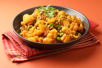 Aloo gobi is a simple vegetarian dish made with potatoes, cauliflower, spices and herbs