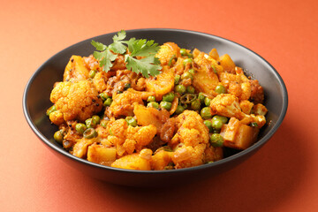 Aloo gobi is a simple vegetarian dish made with potatoes, cauliflower, spices and herbs
