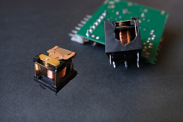 Inside of electromechanical power relays. Relay is an electrically operated switch. Two image...