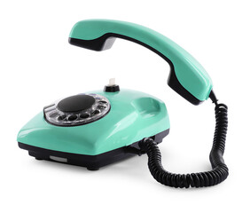 Old aquamarine telephone with rotary dial isolated on white