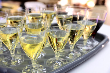 A lot of glasses of champagne in a nice atmosphere at a party.
