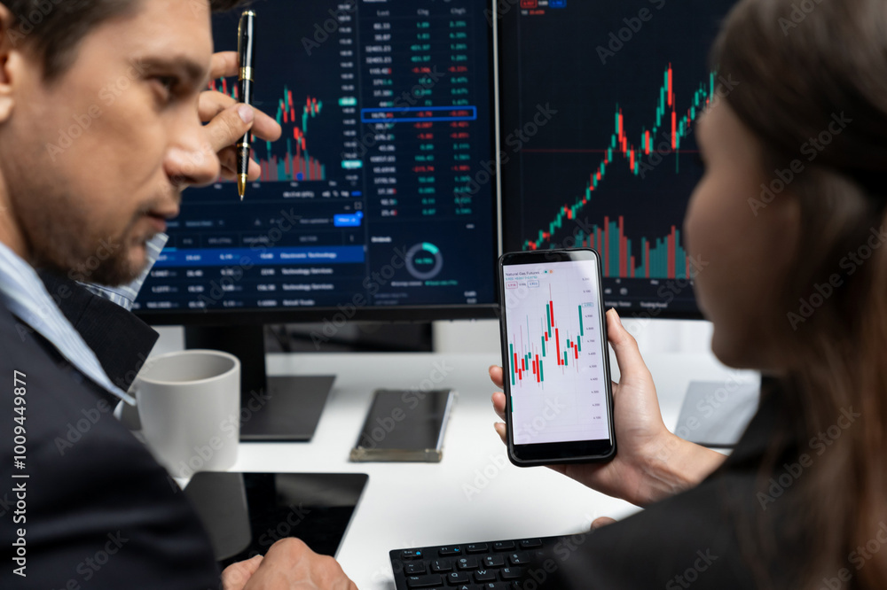 Poster focusing on phone with discussing dynamic stock market in two business traders online website compar