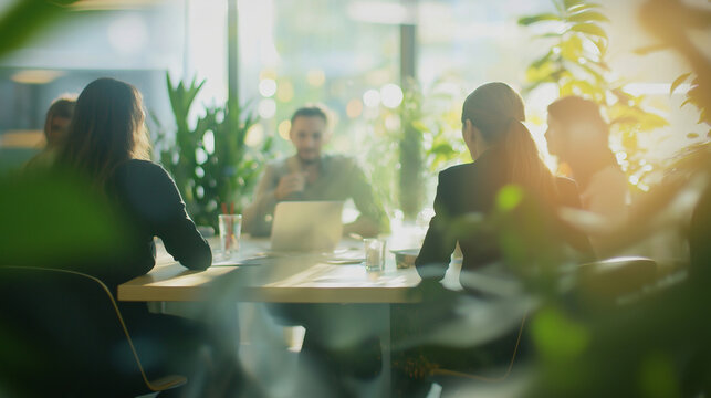 Team of business professionals is having a productive meeting in a modern office filled with natural light and lush green plants, fostering a positive and eco-conscious work environment - Powered by Adobe