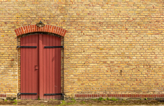 Yello brick wall with read blindes 