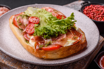 Ciabata with jamon or prosciutto, tomatoes, cheese and lettuce