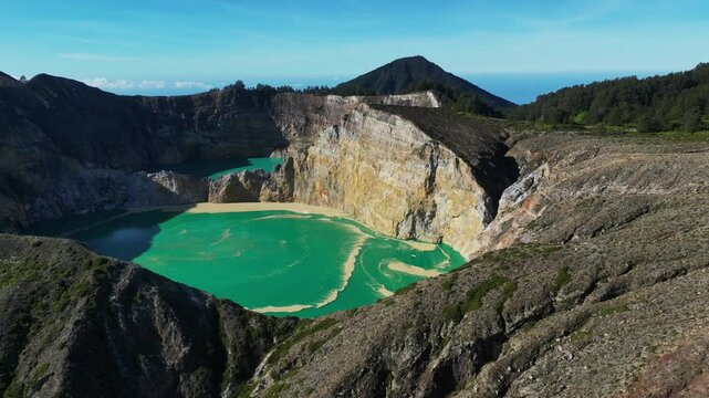 Aerial view of volcano Kelimutu with tricolored lakes in Flores